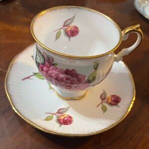 this is a vintage Royal Crest England fine bone china teacup and saucer set.